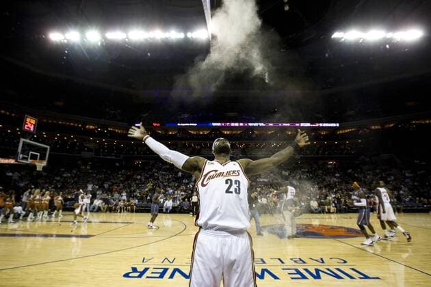 Cleveland Cavaliers forward LeBron James (23) blows powder into the air as a pre-game ritual against the Charlotte Bobcats during an NBA basketball game at Time Warner Cable Arena in Charlotte, North Carolina November 27, 2009. Icon329091127013 EDITORIAL USE ONLY
