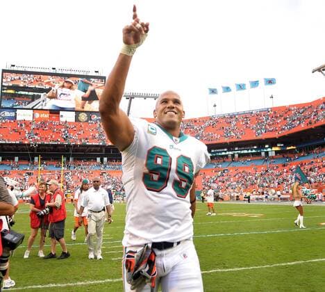 Dec. 06, 2009 - miami, Florida, USA - Miami ---finsrd06c---Miami Dolphins host the New England Patriots at Land Shark Stadium. Miami s Jason Taylor celebrates as he leaves the field victorious. - ZUMAss5