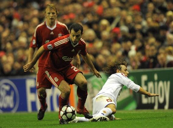 Javier Mascherano of Liverpool FC (L) skips past the tackle of Marco Donadel of ACF Fiorentina UEFA Champions League Group E Liverpool v Fiorentina 9th December, 2009 EDITORIAL USE ONLY. No use with unauthorised audio, video, data, fixture lists, club league logos or live services. Online in-match use limited to 120 images, no video emulation. No use in betting, games or single club league player publications. o0 AC Florenz