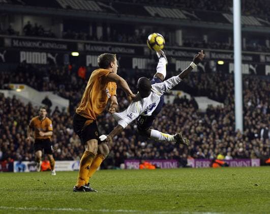 Tottenham s Jermain Defoe (R) tussles with Wolverhampton s Jody Craddock Barclays Premier League Tottenham Hotspur v Wolverhampton Wanderers 12th December, 2009 EDITORIAL USE ONLY. No use with unauthorised audio, video, data, fixture lists, club league logos or live services. Online in-match use limited to 120 images, no video emulation. No use in betting, games or single club league player publications.