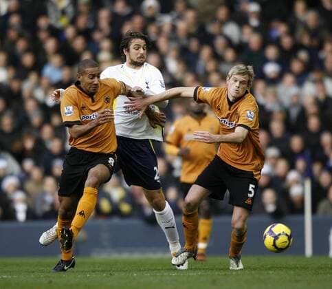 Tottenham s Niko Kranjcar (C) tussles with Wolverhampton s Karl Henry (L) and Richard Stearman Barclays Premier League Tottenham Hotspur v Wolverhampton Wanderers 12th December, 2009 EDITORIAL USE ONLY. No use with unauthorised audio, video, data, fixture lists, club league logos or live services. Online in-match use limited to 120 images, no video emulation. No use in betting, games or single club league player publications.