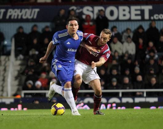 West Ham s Mark Noble (L) tussles with Chelsea s Frank Lampard - Premier League West Ham United v FC Chelsea London 20th December, 2009 EDITORIAL USE ONLY. No use with unauthorised audio, video, data, fixture lists, club league logos or live services. Online in-match use limited to 120 images, no video emulation. No use in betting, games or single club league player publications.