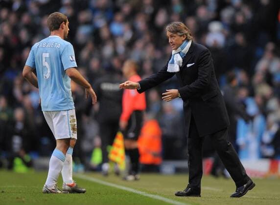 Roberto Mancini coach of Manchester City talks to Pablo Zabaleta of Manchester City Barclays Premier League Manchester City v Stoke City 26th December, 2009 EDITORIAL USE ONLY. No use with unauthorised audio, video, data, fixture lists, club league logos or live services. Online in-match use limited to 120 images, no video emulation. No use in betting, games or single club league player publications.