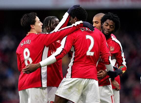 Abou Diaby of FC Arsenal London (C) is congratulated by his teammates after scoring his side s third goal --- Premier League: FC Arsenal London (red) vs. Aston Villa (white), 27th December, 2009 EDITORIAL USE ONLY. No use with unauthorised audio, video, data, fixture lists, club league logos or live services. Online in-match use limited to 120 images, no video emulation. No use in betting, games or single club league player publications. o0 Jubel Freude