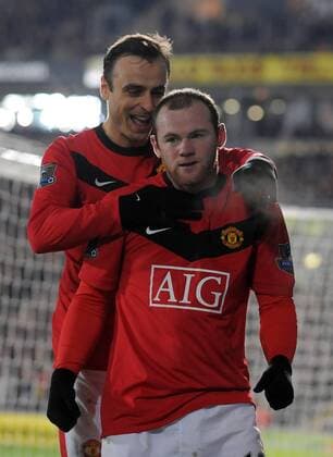 Wayne Rooney of Manchester United (F) celebrates the second goal with Dimitar Berbatov of Manchester United --- Premier League: Hull City (orange) vs. Manchester United (red), 27th December, 2009 EDITORIAL USE ONLY. No use with unauthorised audio, video, data, fixture lists, club league logos or live services. Online in-match use limited to 120 images, no video emulation. No use in betting, games or single club league player publications. o0 Jubel Freude