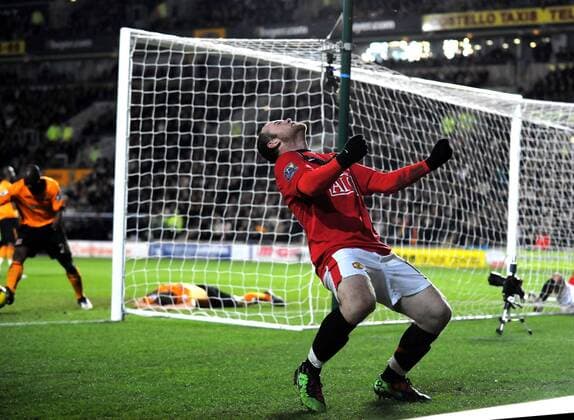 Wayne Rooney of Manchester United celebrates the second goal turned in by Andy Dawson of Hull City from a Rooney cross --- Premier League: Hull City (orange) vs. Manchester United (red), 27th December, 2009 EDITORIAL USE ONLY. No use with unauthorised audio, video, data, fixture lists, club league logos or live services. Online in-match use limited to 120 images, no video emulation. No use in betting, games or single club league player publications. o0 Jubel Freude