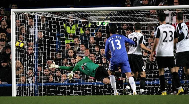 Mark Schwarzer (L) of Fulham keeps out a shot - 2.L Michael Ballack of Chelsea - Barclays Premier League Chelsea FC London vs. Fulham FC 28th December, 2009 EDITORIAL USE ONLY. No use with unauthorised audio, video, data, fixture lists, club league logos or live services. Online in-match use limited to 120 images, no video emulation. No use in betting, games or single club league player publications.