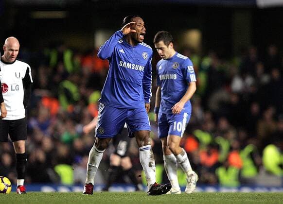 Didier Drogba (C) of Chelsea celebrates by trying to get the fans going after scoring - Barclays Premier League Chelsea FC London vs. Fulham FC 28th December, 2009 EDITORIAL USE ONLY. No use with unauthorised audio, video, data, fixture lists, club league logos or live services. Online in-match use limited to 120 images, no video emulation. No use in betting, games or single club league player publications.