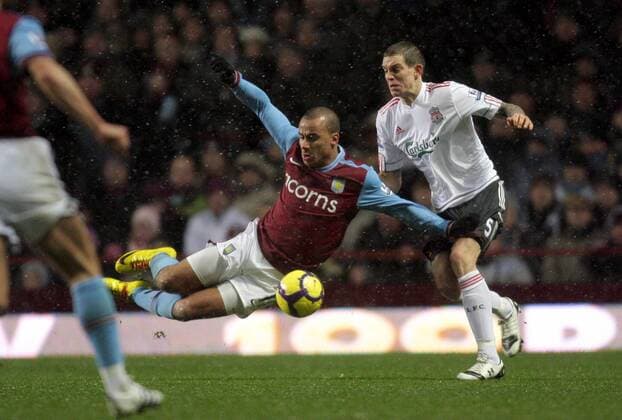 Daniel Agger (R) of Liverpool FC fouls Gabriel Agbonlahor of Aston Villa (l) Barclays Premier League Aston Villa v Liverpool 29th December, 2009 EDITORIAL USE ONLY. No use with unauthorised audio, video, data, fixture lists, club league logos or live services. Online in-match use limited to 120 images, no video emulation. No use in betting, games or single club league player publications. o00 Birmingham