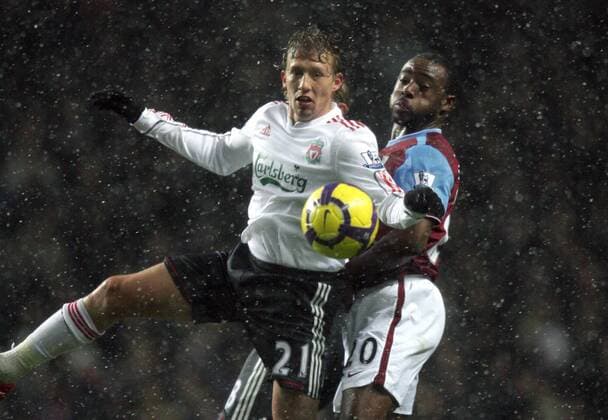 Lucas Leiva (L) of Liverpool FC competes with Nigel Reo-Coker of Aston Villa (r). Barclays Premier League Aston Villa v Liverpool 29th December, 2009 EDITORIAL USE ONLY. No use with unauthorised audio, video, data, fixture lists, club league logos or live services. Online in-match use limited to 120 images, no video emulation. No use in betting, games or single club league player publications. o00 Birmingham