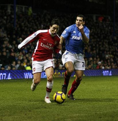 Portsmouth s Tal Ben Haim (R) tussles with Arsenal s Samir Nasri Barclays Premier League Portsmouth v Arsenal 30th December, 2009 EDITORIAL USE ONLY. No use with unauthorised audio, video, data, fixture lists, club league logos or live services. Online in-match use limited to 120 images, no video emulation. No use in betting, games or single club league player publications. o0 FC London