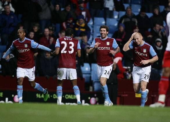 Carlos Cuellar (centre right) smiles atfter scoring Villa s second goal. EON FA Cup 3rd Round Aston Villa v Blackburn Rovers 2nd January, 2010 EDITORIAL USE ONLY. No use with unauthorised audio, video, data, fixture lists, club league logos or live services. Online in-match use limited to 120 images, no video emulation. No use in betting, games or single club league player publications. o0 Jubel Freude