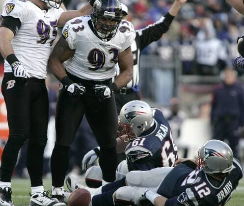 Baltimore Ravens defensive tackle Dwan Edwards (93) celebrates his sack of New England Patriots quarterback Tom Brady (12) in the second half of the AFC Wildcard game at Gillette Stadium in Foxboro, Massachusetts on January 10, 2010. The play did not count because a penalty was called against Baltimore but the Ravens went on to defeat the Patriots 33-14.  BOS2010011031