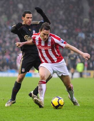 Dean Whitehead of Stoke City (R) shields the ball from Maxi Rodriguez of Liverpool FC - Barclays Premier League Stoke City v Liverpool 16th January, 2010 EDITORIAL USE ONLY. No use with unauthorised audio, video, data, fixture lists, club league logos or live services. Online in-match use limited to 120 images, no video emulation. No use in betting, games or single club league player publications.