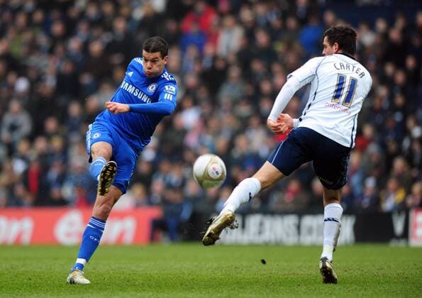 Chelsea FC s Michael Ballack (L) volleys the ball past Darren Carter of Preston North End EON FA Cup 4th Round Preston North End v Chelsea 23rd January, 2010 EDITORIAL USE ONLY. No use with unauthorised audio, video, data, fixture lists, club league logos or live services. Online in-match use limited to 120 images, no video emulation. No use in betting, games or single club league player publications.