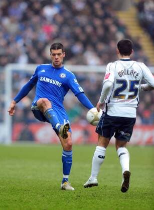 Chelsea FC s Michael Ballack (L) flicks the ball past Ross Wallace of Preston North End EON FA Cup 4th Round Preston North End v Chelsea 23rd January, 2010 EDITORIAL USE ONLY. No use with unauthorised audio, video, data, fixture lists, club league logos or live services. Online in-match use limited to 120 images, no video emulation. No use in betting, games or single club league player publications.