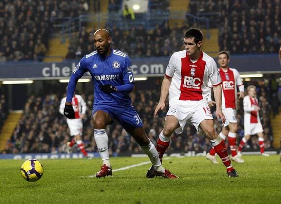 Chelsea s Nicolas Anelka (L) tussles with Birmingham s Scott Dann , Barclays Premier League, Chelsea FC London - Birmingham City, 27th January, 2010 - EDITORIAL USE ONLY. No use with unauthorised audio, video, data, fixture lists, club league logos or live services. Online in-match use limited to 120 images, no video emulation. No use in betting, games or single club league player publications.