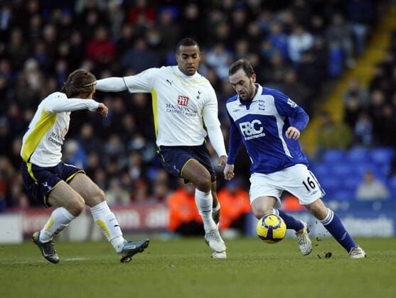 Tottenham s Luka Modric (L) and Tom Huddlestone tussle with Birmingham s James McFadden Barclays Premier League Birmingham City v Tottenham Hotspur 30th January, 2010 EDITORIAL USE ONLY. No use with unauthorised audio, video, data, fixture lists, club league logos or live services. Online in-match use limited to 120 images, no video emulation. No use in betting, games or single club league player publications. o0 Mc Fadden