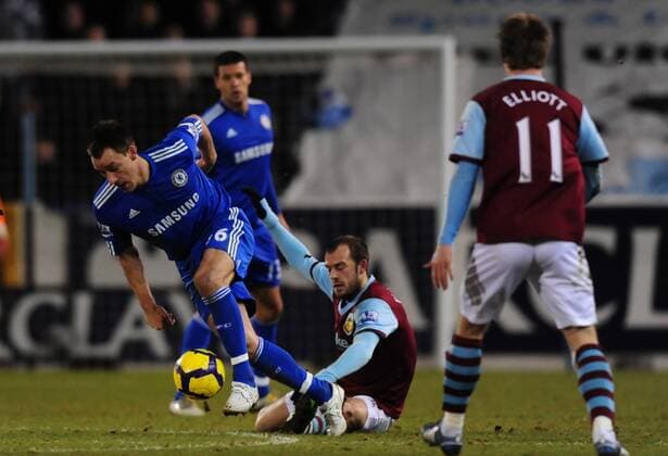 John Terry (L) of Chelsea FC tackles Steven Fletcher of Burnley Barclays Premier League Burnley v Chelsea 30th January, 2010 EDITORIAL USE ONLY. No use with unauthorised audio, video, data, fixture lists, club league logos or live services. Online in-match use limited to 120 images, no video emulation. No use in betting, games or single club league player publications.