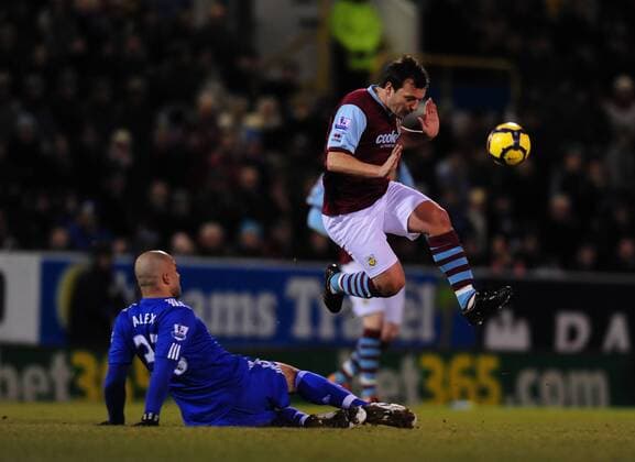 Robbie Blake (R) of Burnley FC leaps over Alex of Chelsea Barclays Premier League Burnley v Chelsea 30th January, 2010 EDITORIAL USE ONLY. No use with unauthorised audio, video, data, fixture lists, club league logos or live services. Online in-match use limited to 120 images, no video emulation. No use in betting, games or single club league player publications.