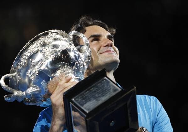 MELBOURNE, Jan. 31, 2010 - Roger Federer of Switzerland holds up the champion trophy during the awarding ceremony after the final match at 2010 Australian Open Tennis Championship at Rod Laver Arena in Melbourne, Australia, Jan. 31, 2010 - 