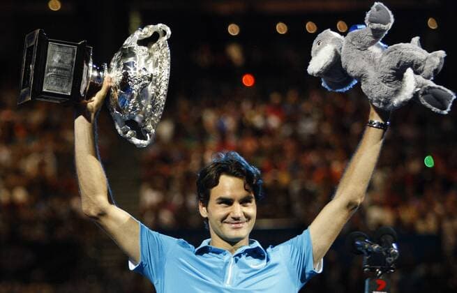 MELBOURNE, Jan. 31, 2010 - Roger Federer of Switzerland holds up the champion trophy during the awarding ceremony after the final match at 2010 Australian Open Tennis Championship at Rod Laver Arena in Melbourne, Australia, Jan. 31, 2010 - 