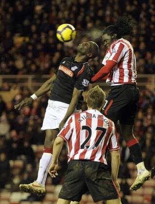 FC Sunderland s Kenwyne Jones r. and Stoke City s Mamady Sidibe. Barclays Premier League Sunderland v Stoke City 1st February, 2010 EDITORIAL USE ONLY. No use with unauthorised audio, video, data, fixture lists, club league logos or live services. Online in-match use limited to 120 images, no video emulation. No use in betting, games or single club league player publications. o00 AFC