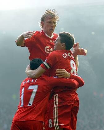 Dirk Kuyt (C) of Liverpool celebrates scoring the winning goal by leaping up onto Steven Gerrard of Liverpool Barclays Premier League FC Liverpool (red) vs. FC Everton (blue) 6th February, 2010 EDITORIAL USE ONLY. No use with unauthorised audio, video, data, fixture lists, club league logos or live services. Online in-match use limited to 120 images, no video emulation. No use in betting, games or single club league player publications. o0 Jubel, Freude,