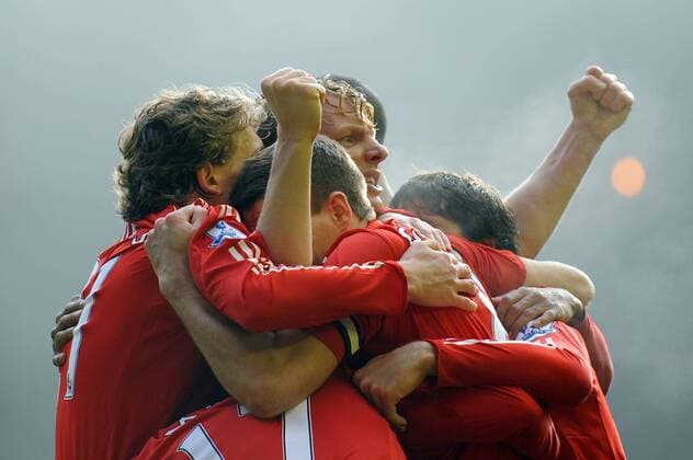 Dirk Kuyt (C) of Liverpool is mobbed as celebrates scoring the winning goal Barclays Premier League FC Liverpool (red) vs. FC Everton (blue) 6th February, 2010 EDITORIAL USE ONLY. No use with unauthorised audio, video, data, fixture lists, club league logos or live services. Online in-match use limited to 120 images, no video emulation. No use in betting, games or single club league player publications. o0 Jubel, Freude,
