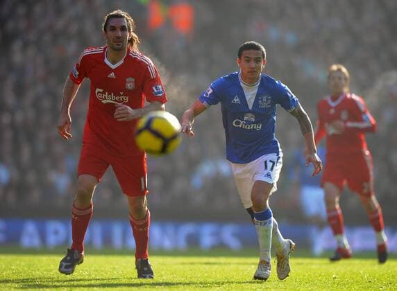 Sotirios Kyrgiakos of Liverpool and Tim Cahill of Everton Barclays Premier League FC Liverpool (red) vs. FC Everton (blue) 6th February, 2010 EDITORIAL USE ONLY. No use with unauthorised audio, video, data, fixture lists, club league logos or live services. Online in-match use limited to 120 images, no video emulation. No use in betting, games or single club league player publications.