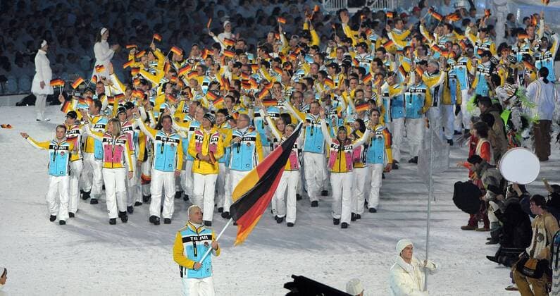 Standard bearer Andre Lange and Germany s Winter Olympic team arrives during the Opening Ceremony for the 2010 Winter Olympics at BC Place Stadium in Vancouver on February 12, 2010.  OLY2010021250 o0 Delegation o00 Olympiateam, Olympiakader