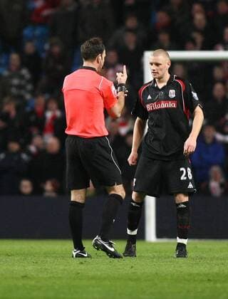 Football Manchester City v Stoke, City of Manchester Stadium FA Cup 13 02 2010 Referee Mark Clattenburg tells Stoke s Andy Wilkinson he is on his last chance - 