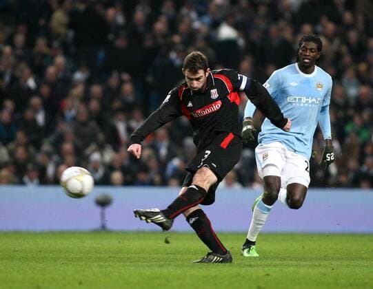 Football Manchester City v Stoke, City of Manchester Stadium FA Cup 13 02 2010 Stoke s Danny Higginbotham (L) strikes towards goal - 