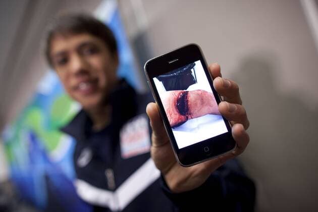 Feb 14, 2010 - Vancouver, Canada - The day after J. R. CELSKI (USA) secured the bronze medal in short track speedskating s 1,500-meter race, he met with reporters at the media center. At the end of his interview session, Celski pulled out his iphone and proudly showed off the photo of his slashed leg to reporters. First-time Olympian J.R. Celski represents the next great hope for U.S. short track. - ZUMAr19 o00 shorttrack