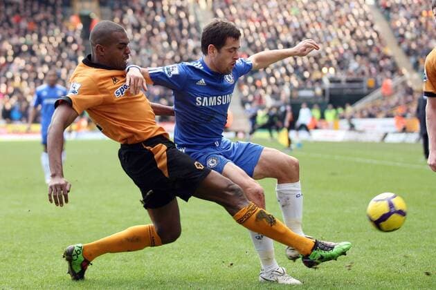 Wolverhampton Wanderers s Ronald Zubar (L) tackles Chelsea s Joe Cole Barclays Premier League Wolverhampton Wanderers v FC Chelsea 20th February, 2010 EDITORIAL USE ONLY. No use with unauthorised audio, video, data, fixture lists, club league logos or live services. Online in-match use limited to 120 images, no video emulation. No use in betting, games or single club league player publications.