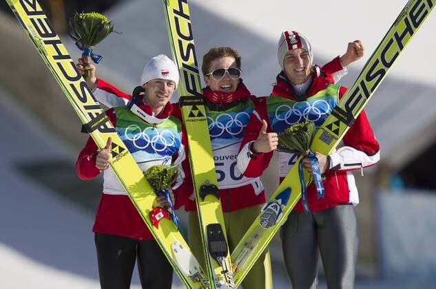 (L to R) Polands Adam Malysz, Switzerland s Winner Simon Ammann and Austria s Gregor Schlierenzauer in Ski Jumping Large Hill Individual Finals during Vancouver 2010 Winter Olympics at the Whistler Olympic Park in Whistler, British Columbia, February 20, 2010.  OLY20100220812 o0 Jubel Freude Sieg Olympiasieg Siegerehrung