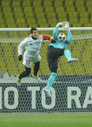 Sevilla s Alvaro Negredo (L) and CSKA s goalkeeper Igor Akinfeev in action during their Champions League game CSKA Moscow vs. Sevilla FC.  Premiumd RE0C90A5
