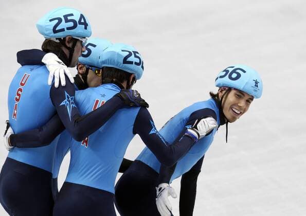 Vancouver , 260210 , Olympische Spiele Vancouver 2010 , Shorttrack , Finale 5000m Männer Staffel, L-R: Travis Jayner , Jordan Malone , J.R. Celski und Apolo Ohno (USA) jubeln