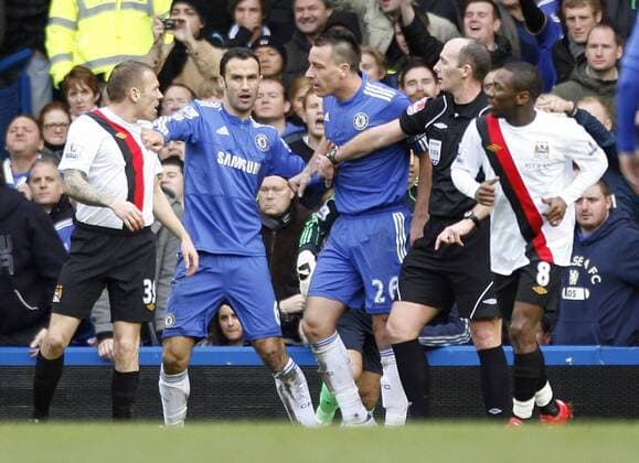 Chelsea s John Terry c. has words with Manchester City s Craig Bellamy l. , 2.l. Ricardo Carvalho Barclays Premier League Chelsea FC London v Manchester City 27th February, 2010 EDITORIAL USE ONLY. No use with unauthorised audio, video, data, fixture lists, club league logos or live services. Online in-match use limited to 120 images, no video emulation. No use in betting, games or single club league player publications.