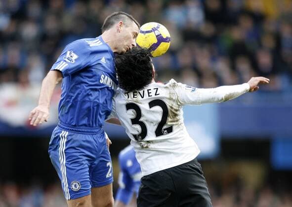 Chelsea FC s John Terry (L) tussles with Manchester City s Carlos Tevez Barclays Premier League Chelsea v Manchester City 27th February, 2010 EDITORIAL USE ONLY. No use with unauthorised audio, video, data, fixture lists, club league logos or live services. Online in-match use limited to 120 images, no video emulation. No use in betting, games or single club league player publications.