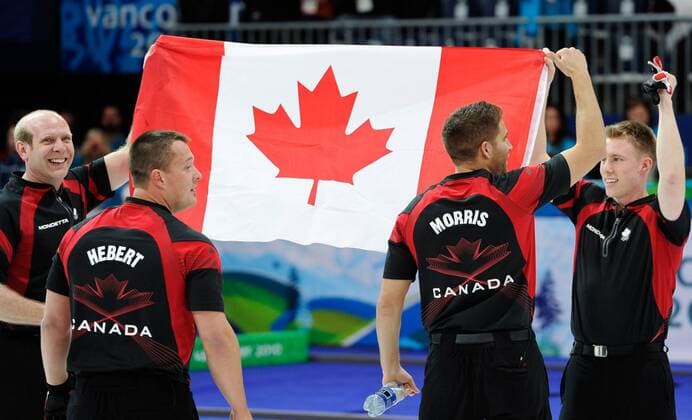 (100227) -- VANCOUVER, Feb. 27, 2010 () -- Canadian players ( Skipp Kevin MARTIN (L) with John MORRIS, Marc KENNEDY, Ben HEBERT, Adam ENRIGHT) celebrate after the men s curling final at the 2010 Winter Olympic Games in Vancouver Olympic Centre, Vancouver, Canada, Feb. 27, 2010. Canada won the goldmedal. o0 Sieg Olympiasieg Jubel Freude Fahne, Nationalfahne