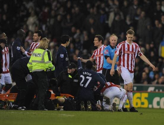 Ryan Shawcross of Stoke City is ushered away by referee Peter Walton as Aaron Ramsey of FC Arsenal lies injured Barclays Premier League Stoke City v FC Arsenal 27th February, 2010 EDITORIAL USE ONLY. No use with unauthorised audio, video, data, fixture lists, club league logos or live services. Online in-match use limited to 120 images, no video emulation. No use in betting, games or single club league player publications.