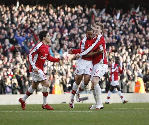 Arsenal s Theo Walcott (C) celebrates scoring his sides second goal Barclays Premier League Arsenal FC vs. Burnley FC 6th March, 2010 EDITORIAL USE ONLY. No use with unauthorised audio, video, data, fixture lists, club league logos or live services. Online in-match use limited to 120 images, no video emulation. No use in betting, games or single club league player publications. o0 Jubel, Freude,