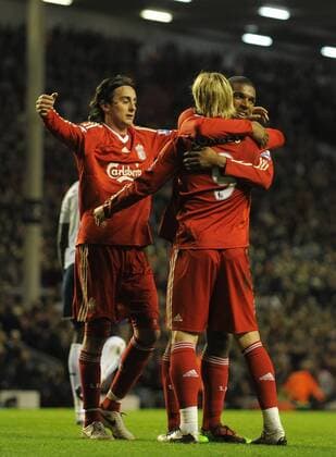 The three first half goalscorers Alberto Aquilani (L) of Liverpool and Fernando Torres (C) of Liverpool celebrate with the second goal scorer Ryan Babel of Liverpool Barclays Premier League FC Liverpool (red) v FC Portsmouth (white) 15th March, 2010 EDITORIAL USE ONLY. No use with unauthorised audio, video, data, fixture lists, club league logos or live services. Online in-match use limited to 120 images, no video emulation. No use in betting, games or single club league player publications.