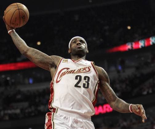 Cleveland Cavaliers LeBron James goes up for a dunk during the first quarter against the Chicago Bulls at the United Center in Chicago on March 19, 2010.  CHI2010031901