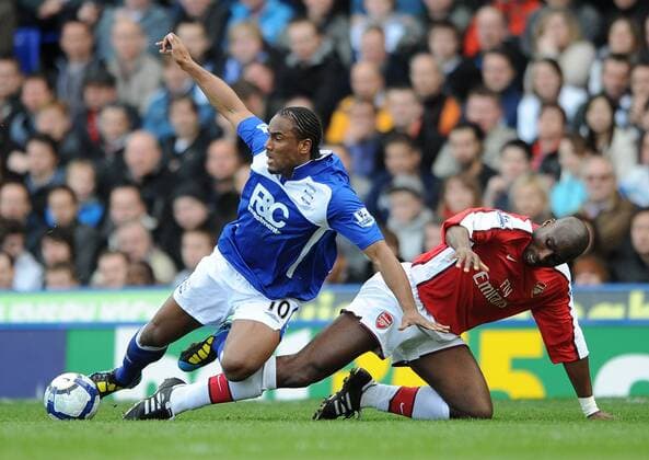 Birmingham City s Cameron Jerome (L) is fouled by Arsenal FC London s Sol Campbell - 