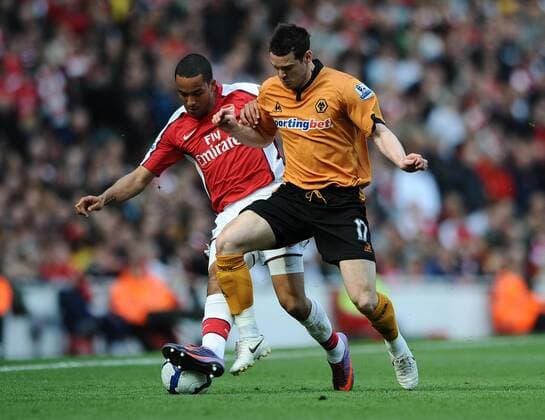 Premier League - Arsenal FC London - Wolverhampton Wanderers 1:0 - Matthew Jarvis of Wolverhampton Wanderers (R) dispossesses Arsenal s Theo Walcott at the Emirates Stadium in London 