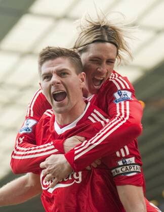 BIRMINGHAM, ENGLAND - Sunday, April 4, 2010: FC Liverpool s captain Steven Gerrard (front) celebrates scoring the opening goal against Birmingham City with team-mate Fernando Torres during the Premiership match at St Andrews. xHOCHxZWEIx xPropagandax 