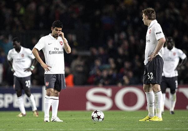 Dejection for Arsenal FC (white): Eduardo (L) and Nicklas Bendtner EDITORIAL USE ONLY. No use with unauthorised audio, video, data, fixture lists, club league logos or live services. Online in-match use limited to 120 images, no video emulation. No use in betting, games or single club league player publications.