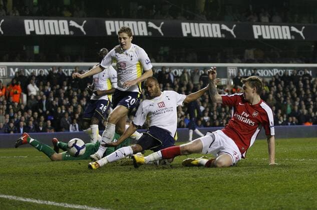 Arsenal s Nicklas Bendtner scoring his sides opening goal Barclays Premier League Tottenham Hotspur (white) vs Arsenal London (red) 14th April, 2010 EDITORIAL USE ONLY. No use with unauthorised audio, video, data, fixture lists, club league logos or live services. Online in-match use limited to 120 images, no video emulation. No use in betting, games or single club league player publications.
